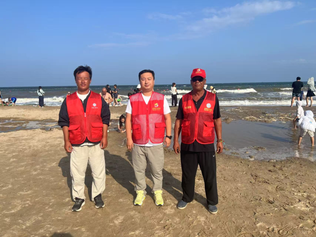 民建会员投身旅游旺季海岸段三级包联(2) (2).jpg